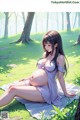 A pregnant woman sitting on a blanket in the woods.